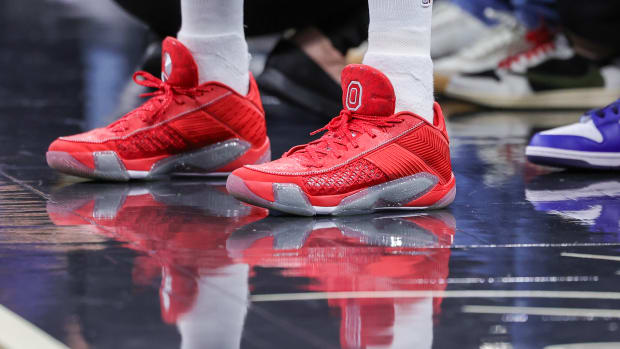 Minnesota Timberwolves guard Mike Conley's scarlet and grey Air Jordan sneakers.